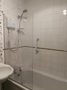 a shower in a bathroom with a sink and a tub at Glasgow Double Room Free Parking in Glasgow