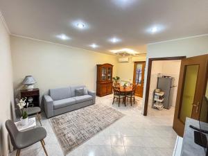a living room with a couch and a table at Casa della Maria in Viareggio