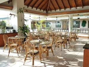 a row of tables and chairs in a restaurant at Hotel Boulevard in Lima