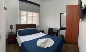Postel nebo postele na pokoji v ubytování Casa Hotel Palermo 49