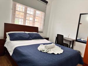Postel nebo postele na pokoji v ubytování Casa Hotel Palermo 49