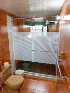 a bathroom with a shower with a toilet at House Life in La Calera +41 photos