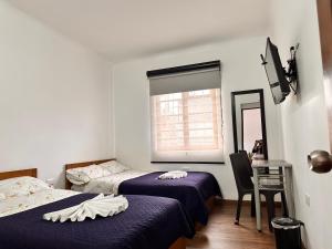 Postel nebo postele na pokoji v ubytování Casa Hotel Palermo 49