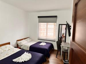 Postel nebo postele na pokoji v ubytování Casa Hotel Palermo 49