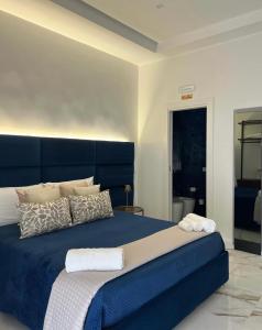 Letto o letti in una camera di Aries Suite Pompei
