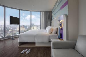 Voodi või voodid majutusasutuse Tru by Hilton Hanoi Station toas