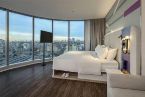 Voodi või voodid majutusasutuse Tru by Hilton Hanoi Station toas