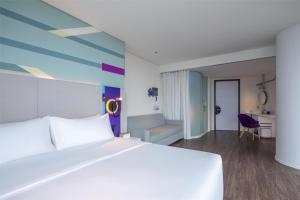 Voodi või voodid majutusasutuse Tru by Hilton Hanoi Station toas