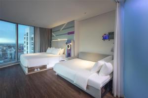 Voodi või voodid majutusasutuse Tru by Hilton Hanoi Station toas