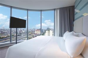 Voodi või voodid majutusasutuse Tru by Hilton Hanoi Station toas