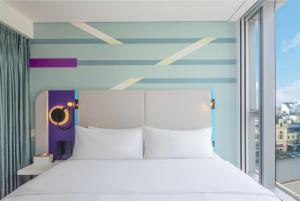 Voodi või voodid majutusasutuse Tru by Hilton Hanoi Station toas