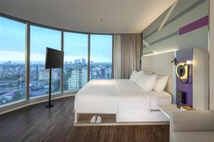 Voodi või voodid majutusasutuse Tru by Hilton Hanoi Station toas