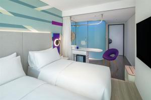 Voodi või voodid majutusasutuse Tru by Hilton Hanoi Station toas