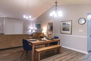 a living room with a table and a couch at Mins to Park River Downtown Chapel Hill Charmer in Indianapolis