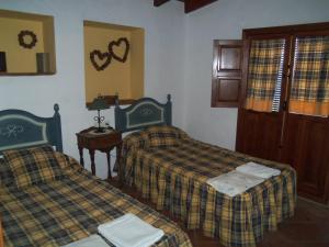 Posteľ alebo postele v izbe v ubytovaní Casas Rurales Jardines del Visir