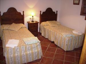 Posteľ alebo postele v izbe v ubytovaní Casas Rurales Jardines del Visir