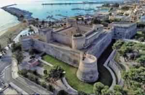an aerial view of a castle next to the ocean at Relais Macramè in Manfredonia
