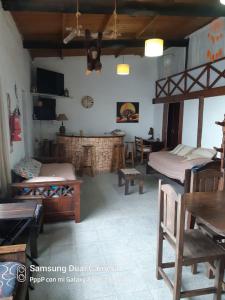 a room with two beds and a fireplace at casa EKYN Tandil in Tandil