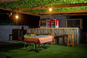 a room with a table and chairs and a gas pump at Kanana Villas - Maun Luxury One Bedroom Apartment in Maun +13 photos