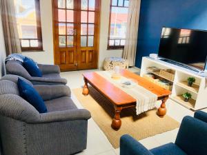 a living room with two couches and a coffee table at Bismarck 2 in Swakopmund