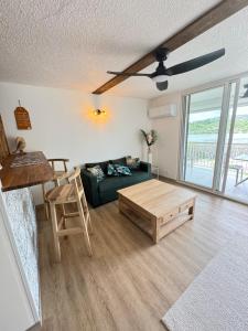 a living room with a couch and a coffee table at Appartement COSY SXM in Cul de Sac