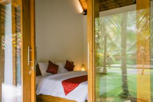 Ένα ή περισσότερα κρεβάτια σε δωμάτιο στο Pondok Sari