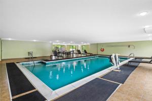 a pool in a hotel room with blue water at Hampton Inn & Suites Richmond/Virginia Center in Richmond