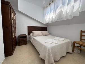 Łóżko lub łóżka w pokoju w obiekcie LA GEODA vivienda vacacional turística 8 personas