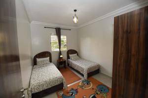 Voodi või voodid majutusasutuse Jardin de chrifia cosy toas