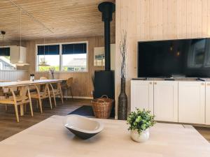a living room with a large flat screen tv at 8 person holiday home in Otterup in Otterup