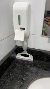 a bathroom with a white toilet in a stall at Hotel e Restaurante Santa Isabel in São Raimundo Nonato