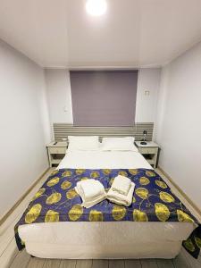 Letto o letti in una camera di Hotel Divasto