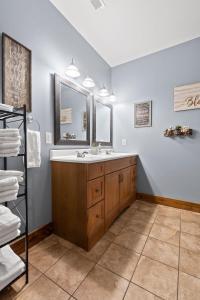 a bathroom with a sink and a mirror at Updated Cabin - Hiwassee Highlife in Decatur