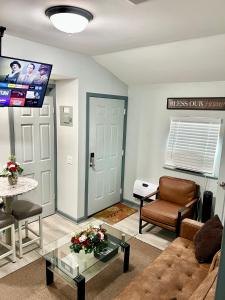 a living room with a couch and a table at Charming two bedroom duplex apartment in Autaugaville