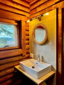 a bathroom with a sink and a mirror at スターダスト高山 in Nakayama +49 photos