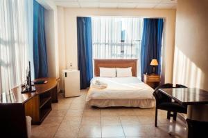 Postel nebo postele na pokoji v ubytování Hotel Las Peñas
