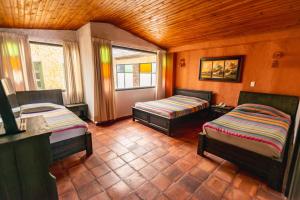 Postel nebo postele na pokoji v ubytování HOTEL COMPOSTELLA