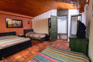 Postel nebo postele na pokoji v ubytování HOTEL COMPOSTELLA