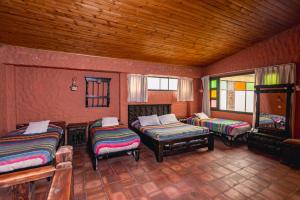 Postel nebo postele na pokoji v ubytování HOTEL COMPOSTELLA