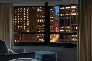 a view of a city skyline from a window at New York Hilton Midtown in New York