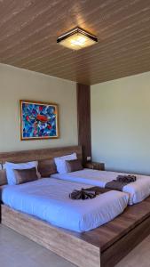 Postel nebo postele na pokoji v ubytování Maya Ocean Resort