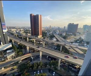 an overhead view of a highway in a city with traffic at The Base - Rama 9 by Sumaq Property in Bangkok