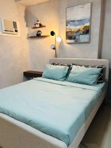 Katil atau katil-katil dalam bilik di NEW Condo in Cebu City with Pool & WiFi