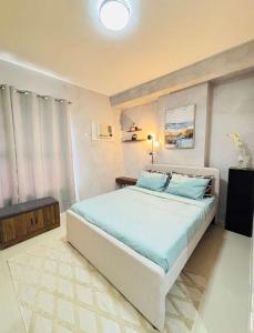 Katil atau katil-katil dalam bilik di NEW Condo in Cebu City with Pool & WiFi