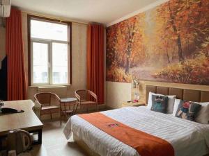a hotel room with a bed and a painting on the wall at PAI Hotel Beijing Capital International Airport Linhe Development Zone in Beijing