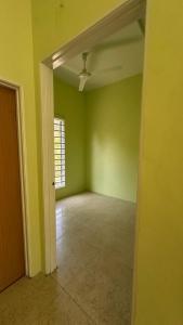 an empty room with green walls and a ceiling at Baitul Ilmi Homestay in Kuala Kangsar