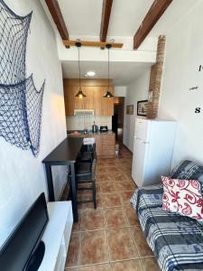 Køkken eller tekøkken på Port Serrallo Apartament + 5 billeder