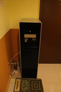 a small black machine sitting on the floor in a room at Sun Inns Hotel Sentral, Brickfields in Kuala Lumpur +23 photos