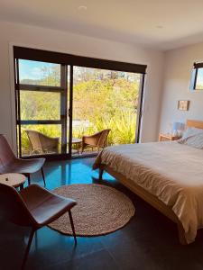 Ένα ή περισσότερα κρεβάτια σε δωμάτιο στο Cozy Coastal Living