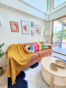 a living room with a couch and a table at Tara Vela in Chumphon